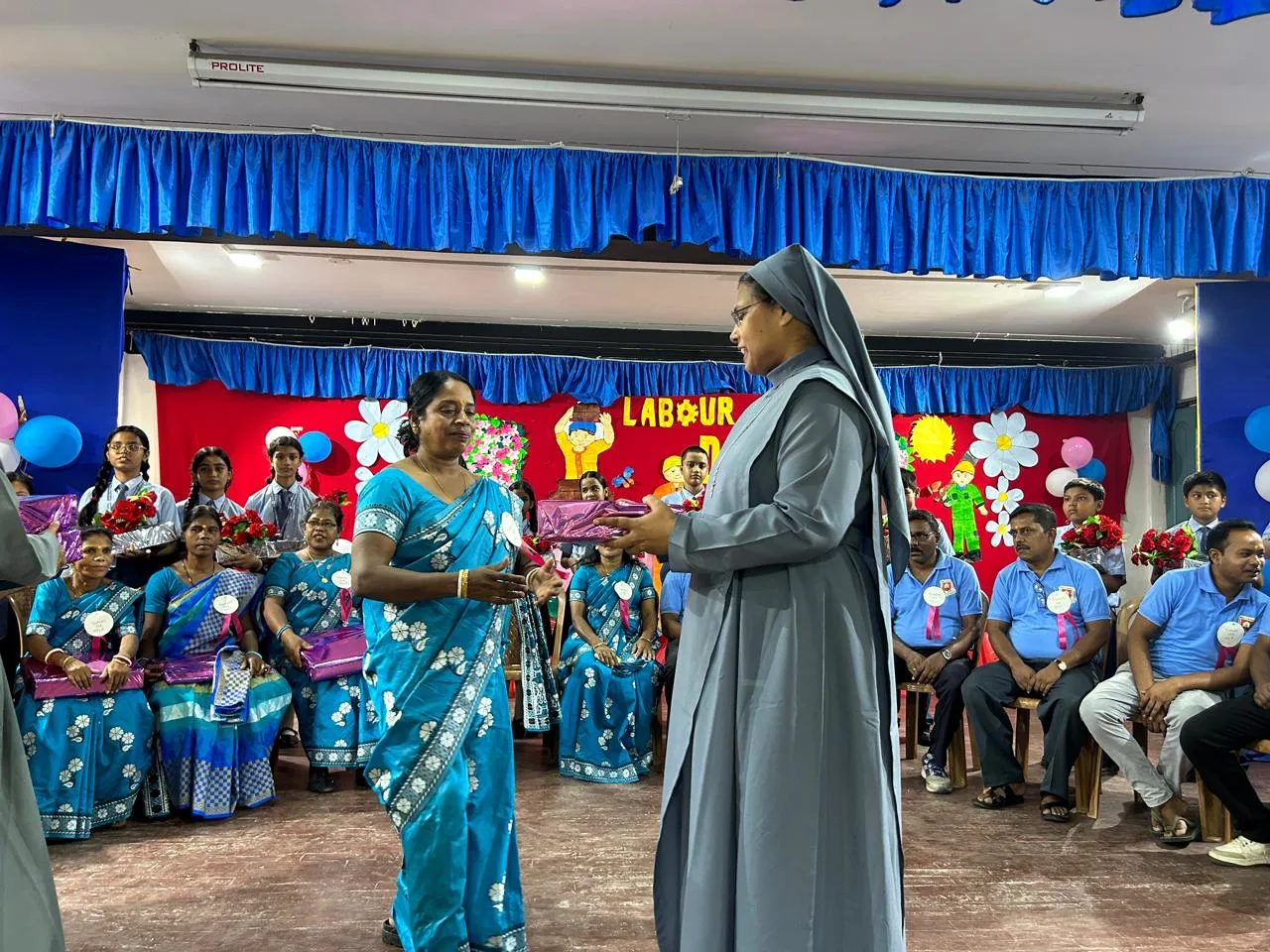 School management appreciating support staff on May Day celebration